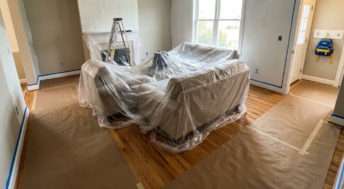 Furniture and floors covered before painting